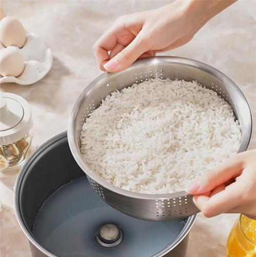 如何解决米饭夹生电饭煲坏了的问题（电饭煲故障解决方法）  第1张